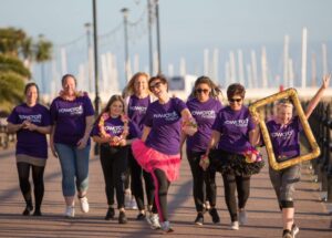 Group of women walking by the harbour